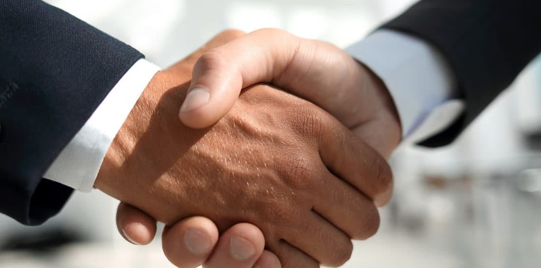 Close-up of business people handshaking Close-up of business people handshaking