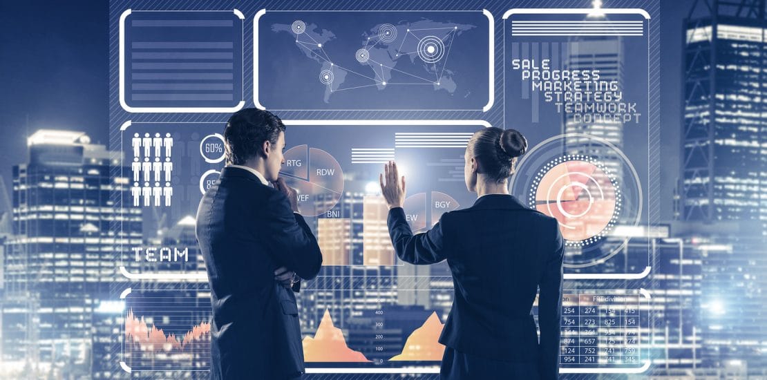 Two Business People Standing With Back And Working Together With Two business people standing with back and working together with virtual screen
